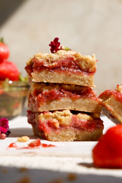 close up image of vegan strawberry crumble bars, made with fresh strawberries