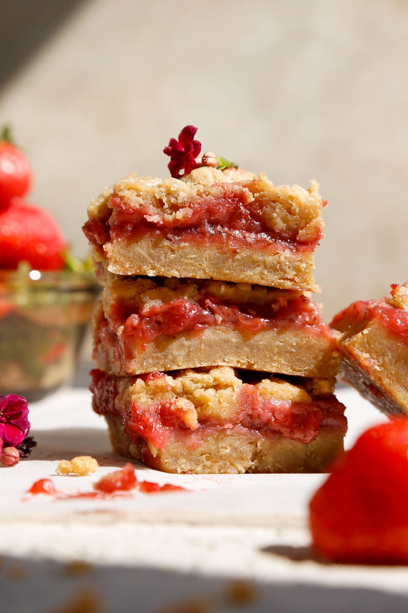 close up image of vegan strawberry crumble bars, made with fresh strawberries