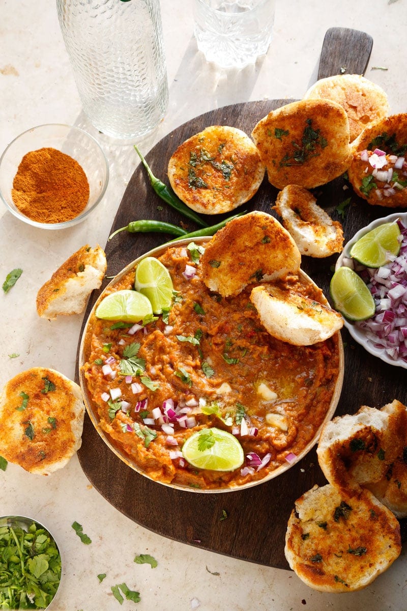 image of healthy vegan pav bhaji with limes and onions
