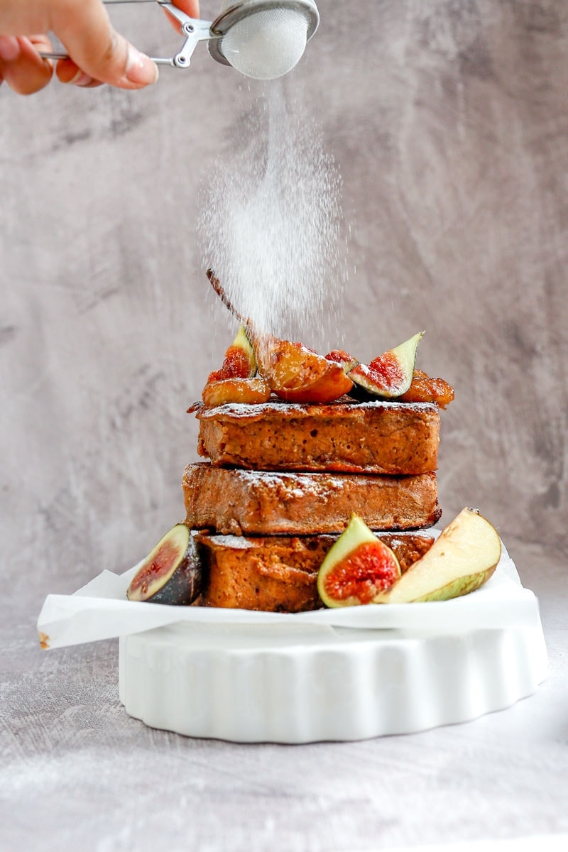 Image of Vegan Banana Bread French Toast being dusted with icing sugar| cookingwithparita.com