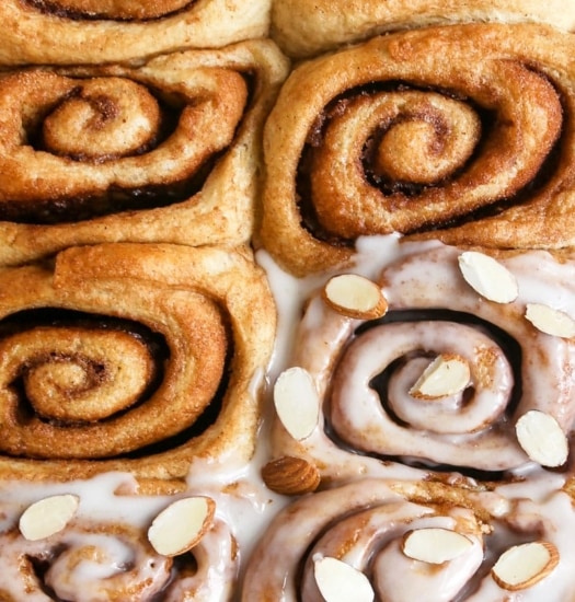 close up image of vegan triple almond cinnamon rolls | cookingwithparita.com