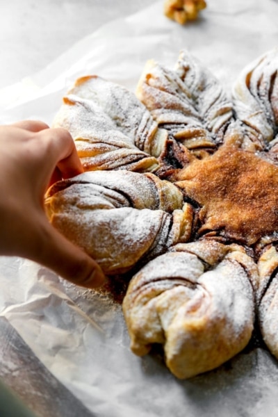 Image of Vegan Snowflake Pull-Apart Monkey Bread being pulled | cookingwithparita.com