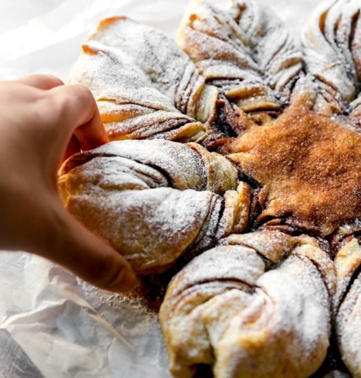 Image of Vegan Snowflake Pull-Apart Monkey Bread being pulled | cookingwithparita.com