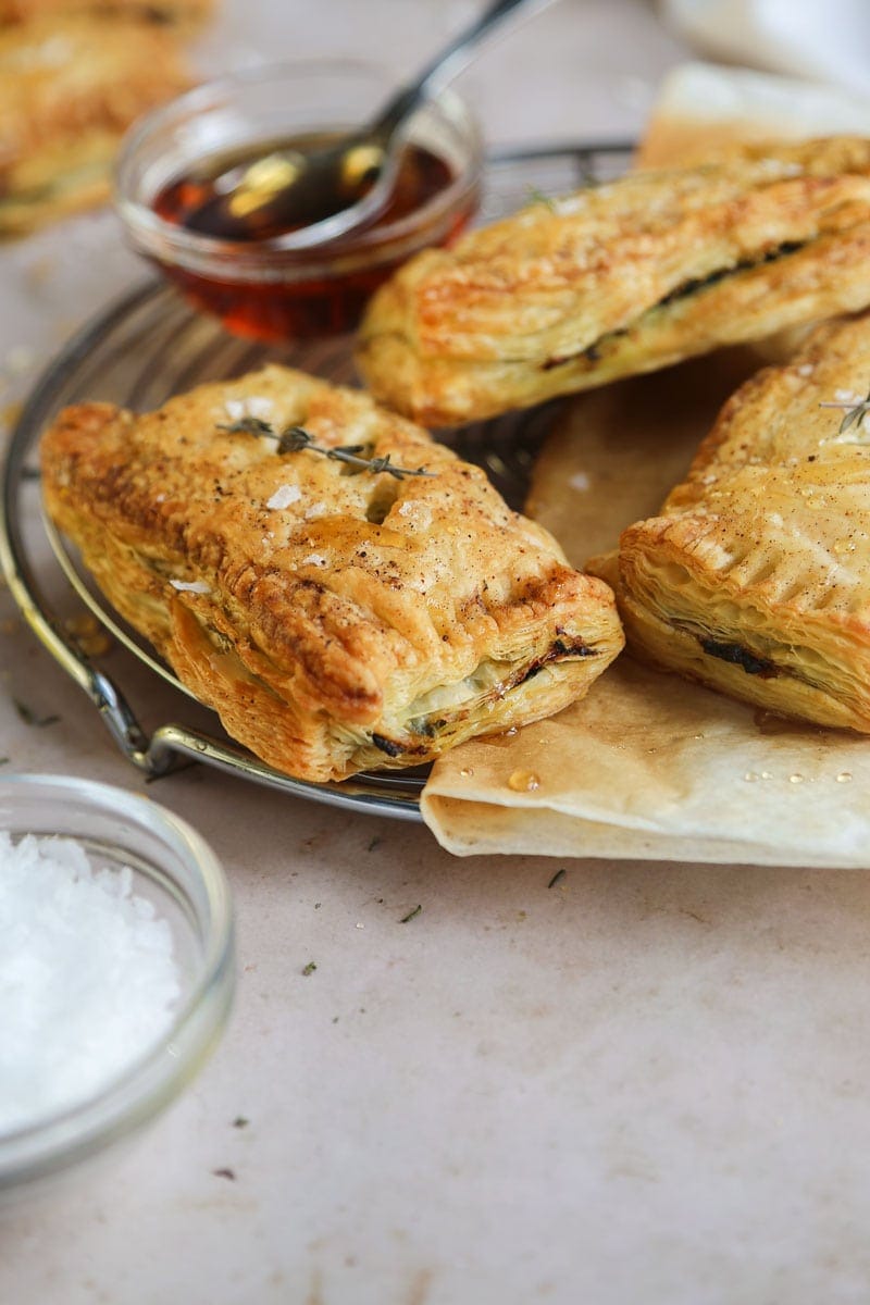 Image of Flaky vegan caramelised onion & cheesy spinach pastries | cookingwithparita.com