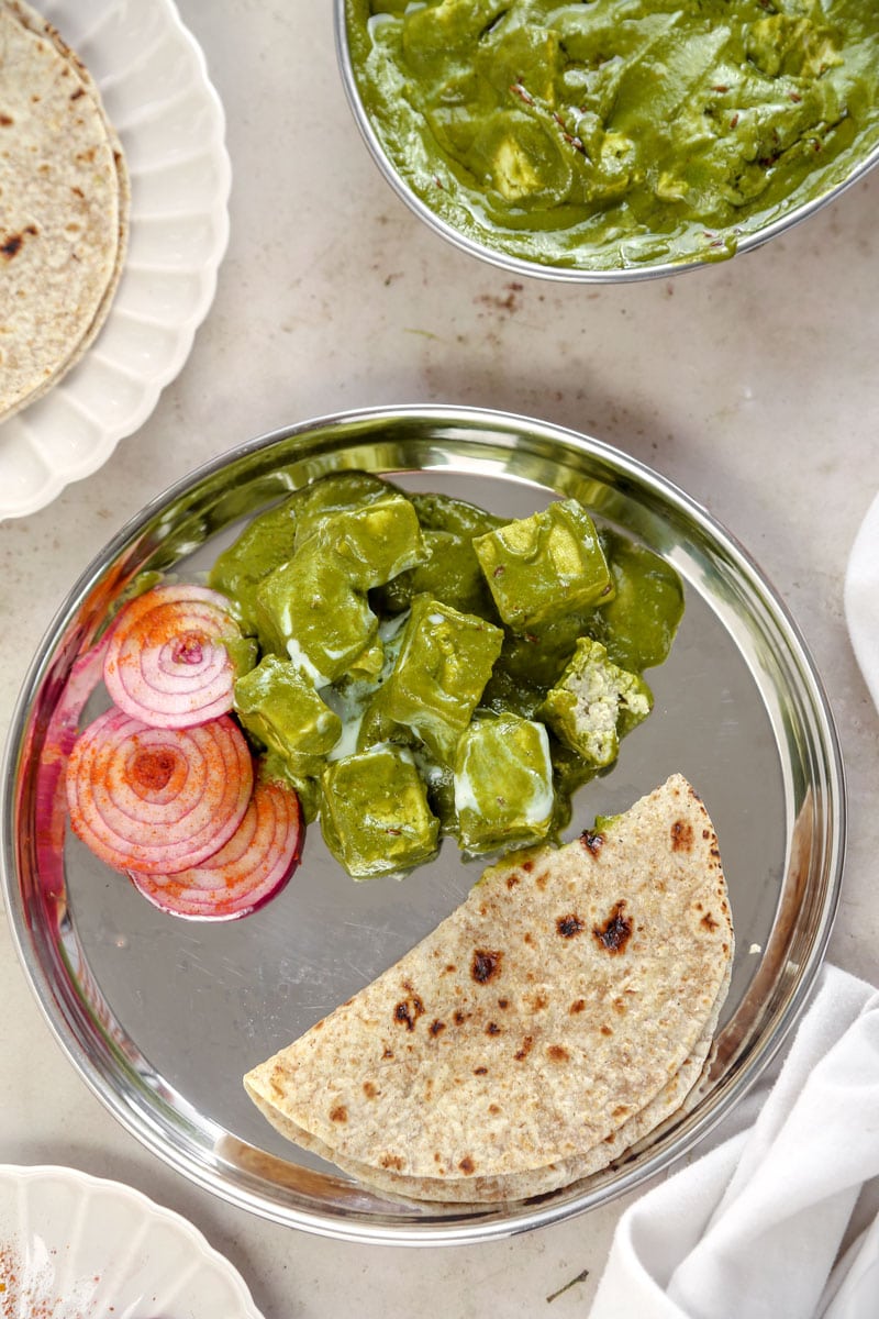 Image of vegan spinach tofu Indian curry with roti