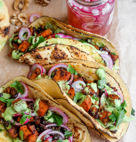 Image of vegan sheet pan sweet potato tacos with avocado crema