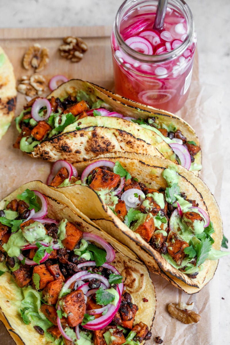 Image of vegan sheet pan sweet potato tacos with avocado crema