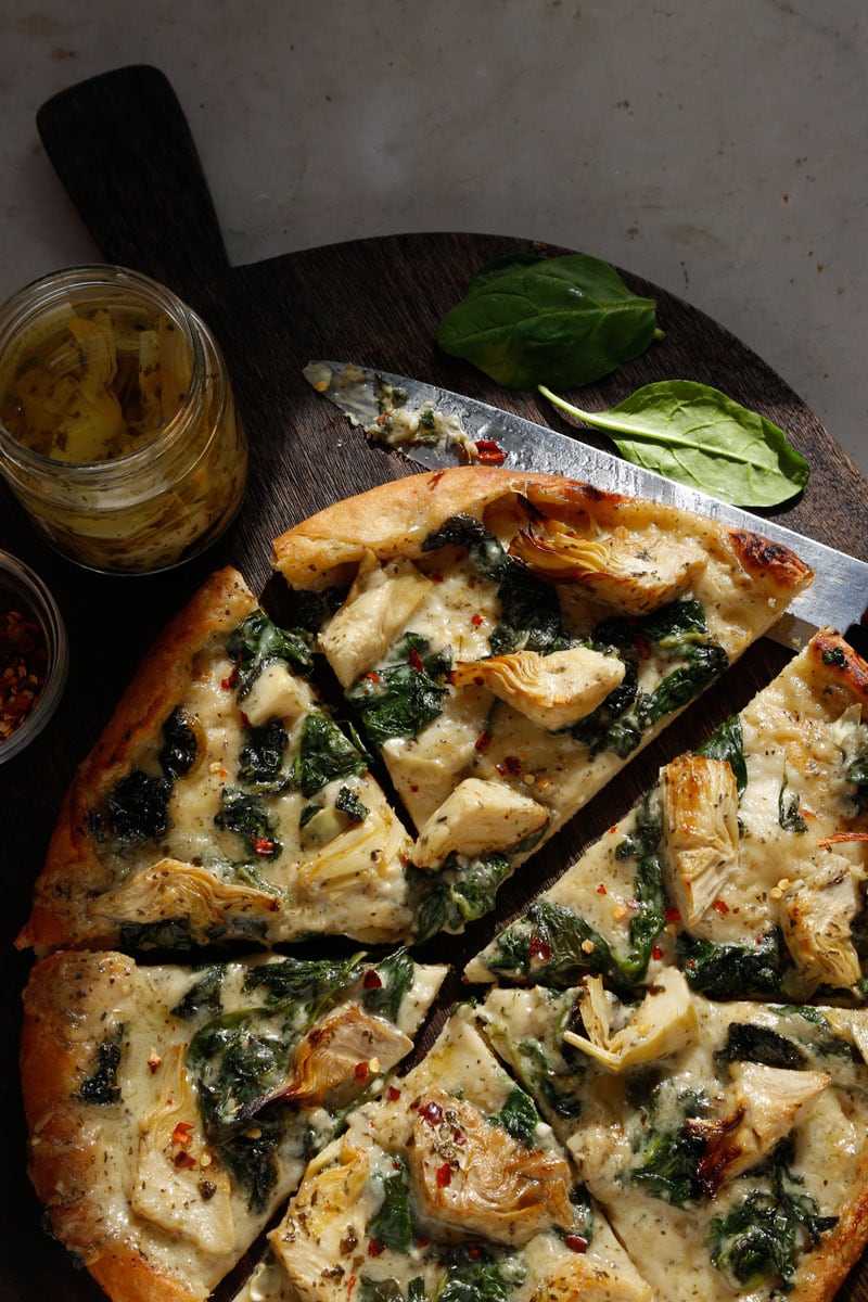 Images of sliced vegan Image of vegan Spinach Artichoke Pizza